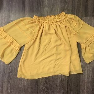 Over the shoulder yellow shirt